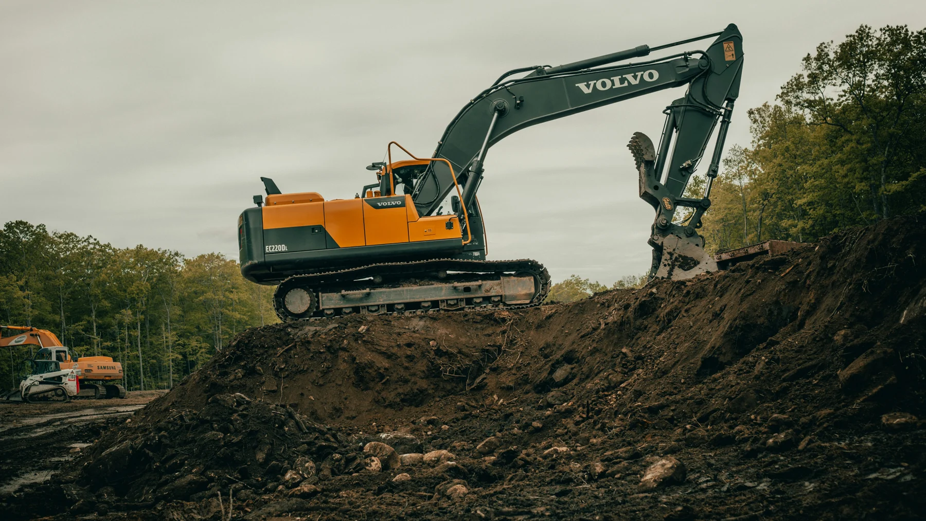 Illustrative photo of an excavator working on earth, by Billy Freeman